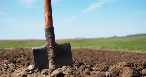 Shovel breaking ground at a land development site